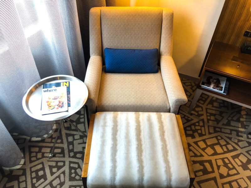 Hilton New York Times Square armchair ottoman and side table close-up