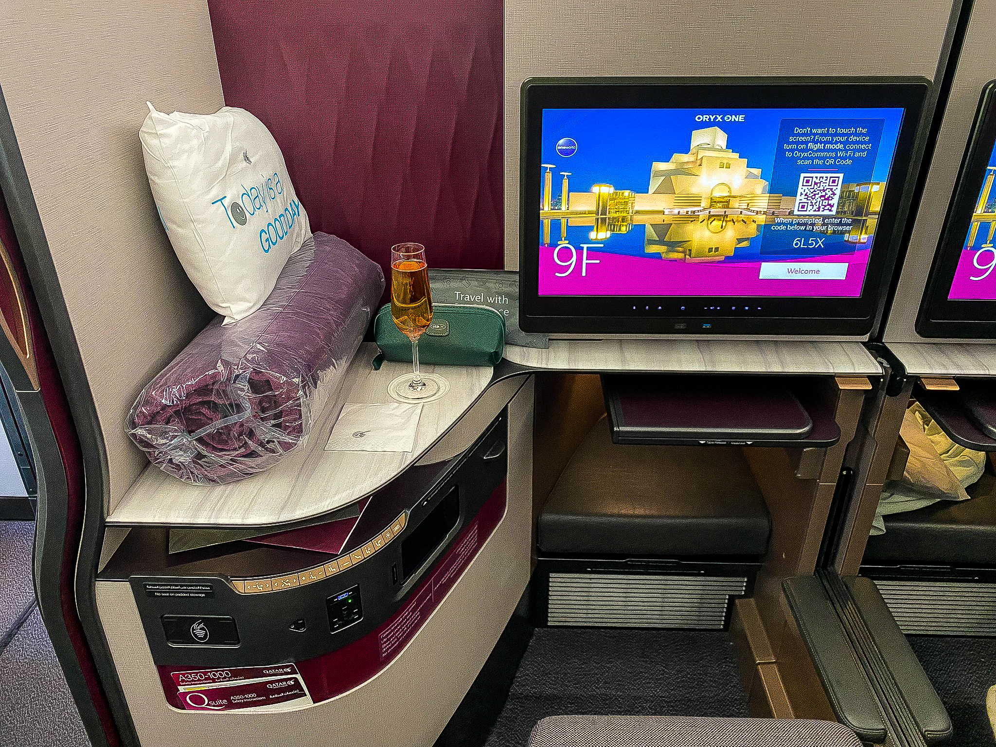 Qatar Airways Qsuites in-flight monitor and amenities