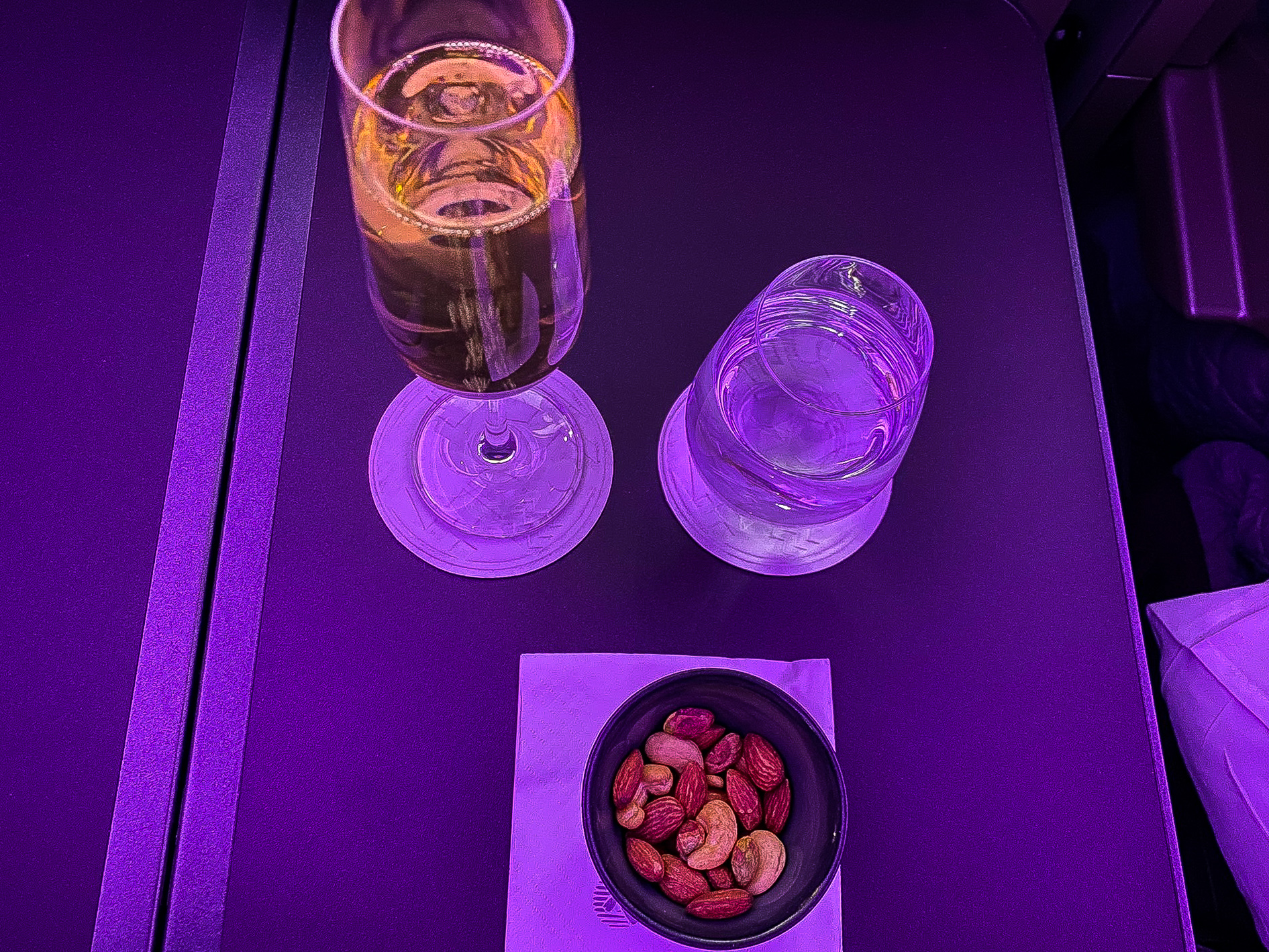Qatar Airways Qsuites warm nuts and Champagne